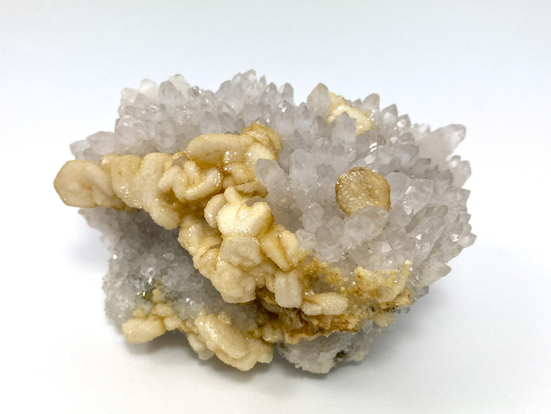 Calcite on light amethyst, Cavnic, Maramures, Romania