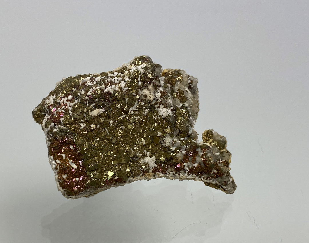 Marcasite, pyrite with tarnish on calcite, Hüttenberg, Carinthia, Austria